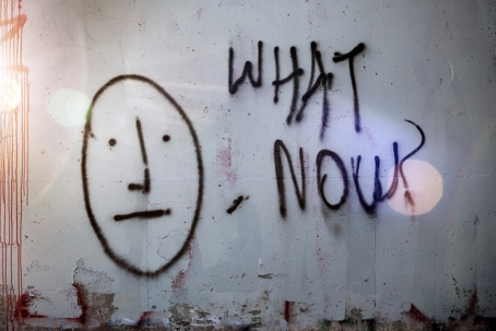 Art on wall saying "what now?"
